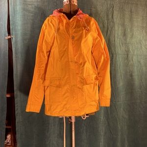 Yellow rain jacket/wind-breaker. Shell:100%nylon. Lining:100%cotton. Cute!